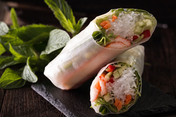 Delicious vietnamese spring roll with vegetable on dark background ,healthy food