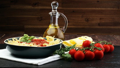 Plate of delicious spaghetti Bolognaise or Bolognese with savory minced beef and tomato sauce garnished with parmesan cheese and basil
