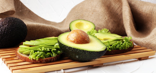 Sandwich with avocado - healthy breakfast concept