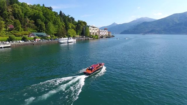 Boat with passengers on Como lake - Cadenabbia and Tremezzo