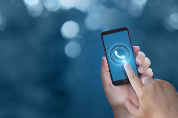 The hand presses the call button.