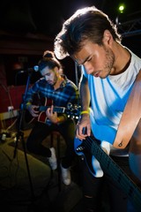 Guitarist playing guitar on stage
