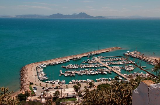 View of the port of Sidi Bou Said, Tunisia/ Top view of the port of Sidi Bou Said in Tunisia with yachts, mountains and azure water
