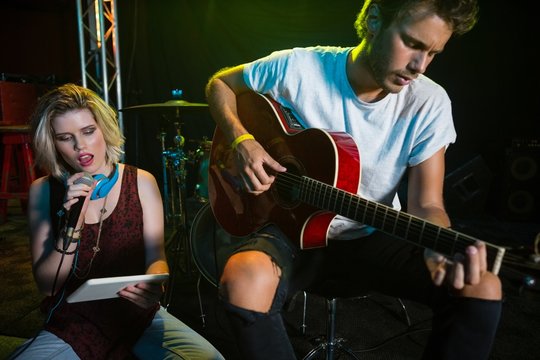 Female singer singing on vintage microphone