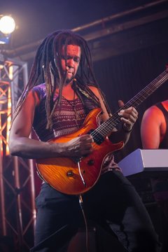 Guitarist playing guitar on stage