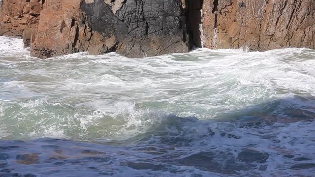 Ocean big waves crashing rocky coastline. Cabo da Roca, Portugal