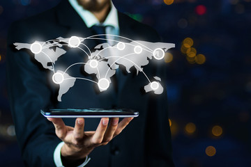 Businessman interacting with a virtual world map