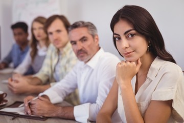 Business people sitting in conference room
