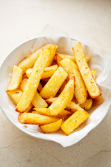 Potato fries chips in white bowl 