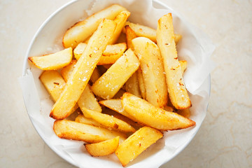 Potato fries chips in white bowl 