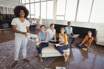 Fototapeta premium Smiling business people in creative office