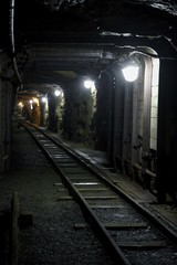 Fototapeta na wymiar Old dark dangerous mine corridor
