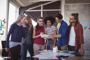 Creative business people using digital tablet