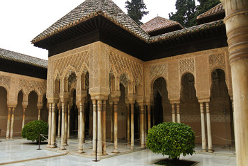 GRANADA, SPAIN - FEBRUARY 10, 2015: An archway to Court of the Lions with fountain at Alhambra palace, Granada, Andalusia, Spain.