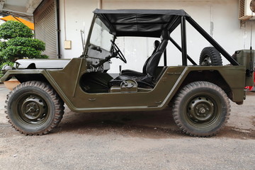 Old all-terrain vehicle stationed on a downtown street. Vientiane-Laos. 4823