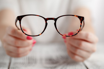 Hand holding glasses