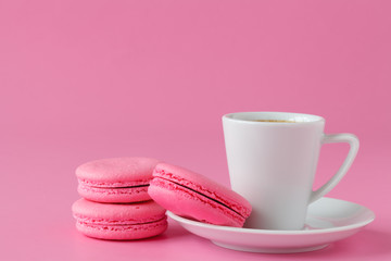 Set of pink macaroon with coffee cup