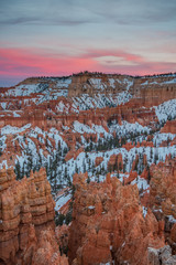 Pink Clouds Above Byce Point  with lingering snow over hoodoos