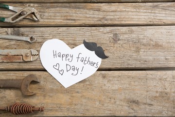 heart shape paper with happy fathers day text 