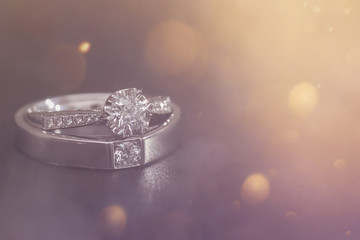 Diamond wedding ring on smoke background