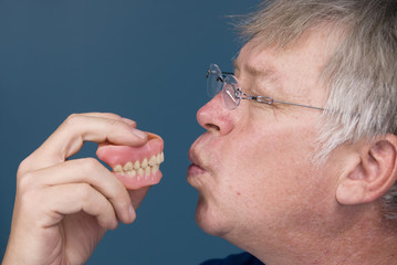 Man kissing dentures