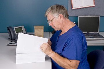 Doctor reviewing document