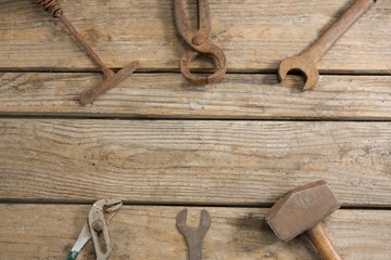 Overhead view of rusty work tools on table