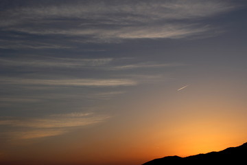 夕焼け空と彩雲  Crimson sky at sunset and beautifully colored cloud.