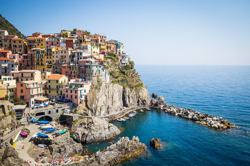 Fototapeta na wymiar Manarola in Cinque Terre, Italy - July 2016 - The most eye-catching of Cinque Terre towns