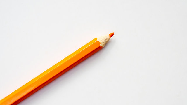 color orange pencil on white background