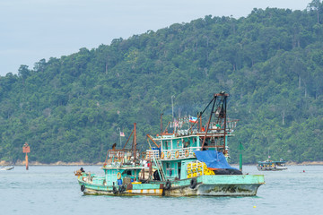 Fisherman boats anchored at Kota Kinabalu (KK). KK is a major city with unquestionably some of the best beaches on the Borneo island. - obrazy, fototapety, plakaty