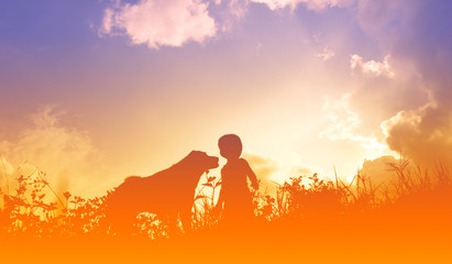 Fototapeta premium silhouettes of a kid and dog sunset