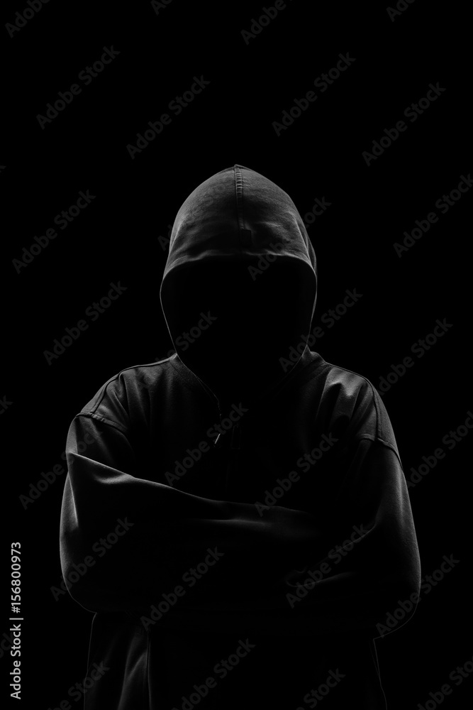 Wall mural silhouette of a hacker isloated on black background