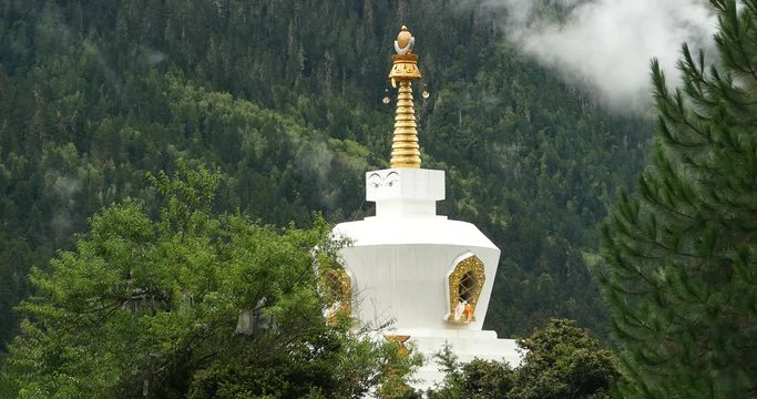 4k tibet buddhist white stupa,cloud cover mountain.