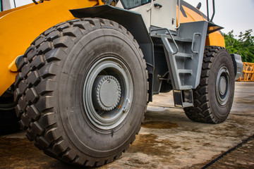 closeup photo of big wheel of loader
