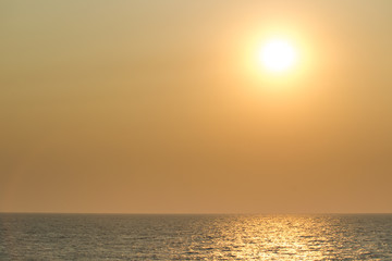 Fototapeta na wymiar Landscape of the big sun over the sea close up.