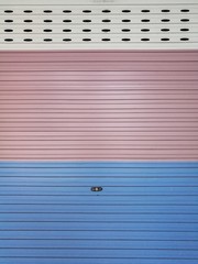 Storage unit folding door, colorful roll gates shop door, old vintage metal shuttered roller color door, White cream, pink and bule steel rolling shutter shop door background