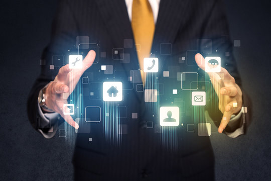 Businessman holding blue applications