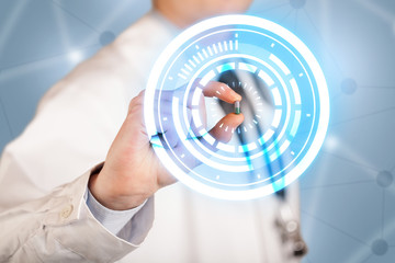 Male doctor holding a pill with glowing circles