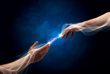 Hands connecting through fingers in space