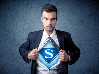 Businessman ripping off his shirt with superhero sign