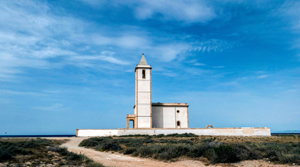 Fototapeta na wymiar San Miguel Beach and Salinas church, take in Cabo de gata, Almeria, Andalusia, Spain