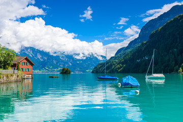 Bay of  Lake Brienz at Village Iseltwald - beautiful lake in the alps at Interlaken, Switzerland