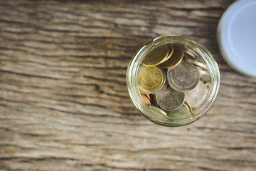 Close up  coin on wood background selective and soft focus hipster tone