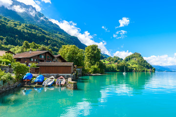 Fototapeta na wymiar Village Iseltwald at Lake Brienz - beautiful lake in the alps at Interlaken, Switzerland