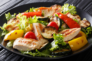Warm salad of grilled vegetables and chicken close-up. horizontal