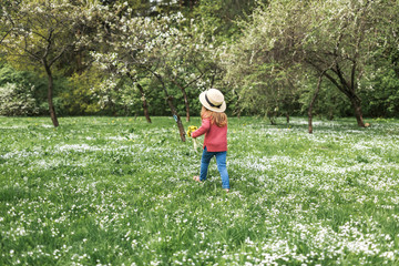 woman in hat and dress in garden