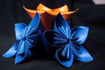 Fototapeta premium Origami flower on black background