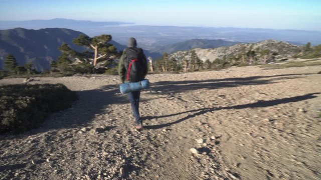 Hiker on a trail alone in the wilderness