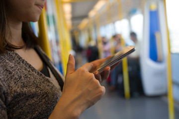 Asian woman using phone for chat and search information